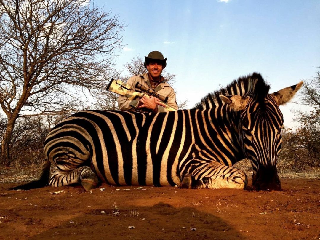 Jason Zuhlke in South Africa with his Zebra taken at Doornrand Hunting Safaris