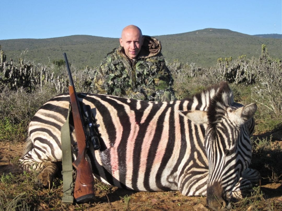 Stefon Zebra with a rifle